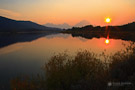 The sun sets at Oxbow Bend, Grand Teton National Park, Wyoming.